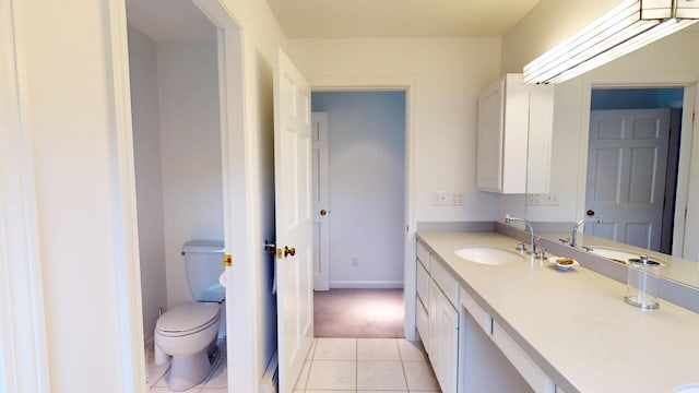 28 Meadow Ln, Brewer, ME 04412 - bathroom with toilet, tile patterned flooring, vanity, and baseboards