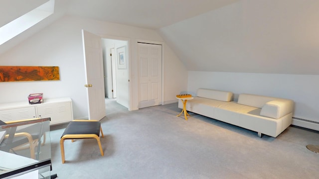 28 Meadow Ln, Brewer, ME 04412 - living area with vaulted ceiling, a skylight, carpet floors, and baseboard heating