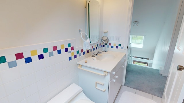 28 Meadow Ln, Brewer, ME 04412 - half bathroom featuring a skylight, vanity, tile walls, and toilet