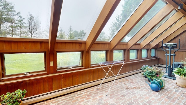 28 Meadow Ln, Brewer, ME 04412 - sunroom featuring baseboard heating, wooden walls, lofted ceiling, brick flooring, and a skylight