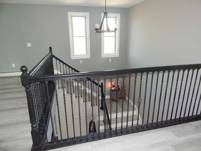 80 Pasture Ln, Brownfield, ME 04010 - stairway with wood finished floors and a chandelier