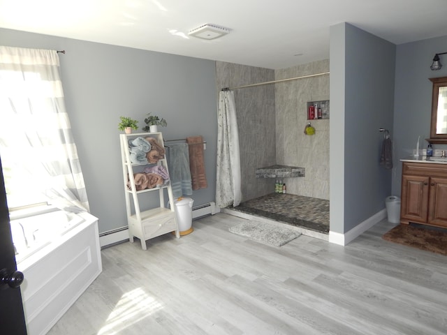 80 Pasture Ln, Brownfield, ME 04010 - bathroom featuring a tile shower, baseboard heating, a garden tub, vanity, and wood finished floors