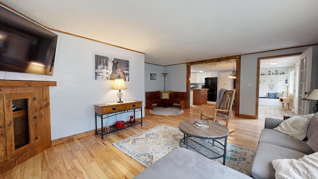 76 School St, Baldwin, ME 04024 - living area with light wood-type flooring and baseboards