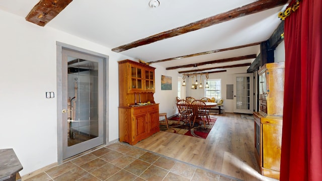 76 School St, Baldwin, ME 04024 - dining area with beam ceiling, electric panel, and baseboards