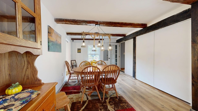 76 School St, Baldwin, ME 04024 - dining room with light wood finished floors and beam ceiling