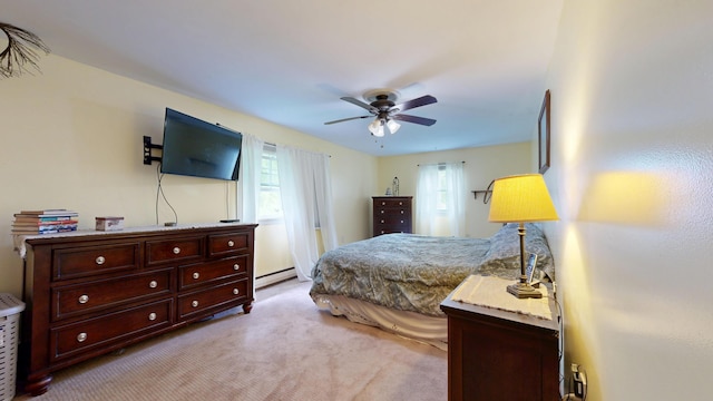 76 School St, Baldwin, ME 04024 - bedroom featuring light colored carpet, a baseboard heating unit, and ceiling fan