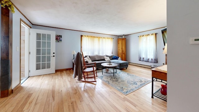 76 School St, Baldwin, ME 04024 - living area featuring light wood finished floors, baseboards, and ornamental molding