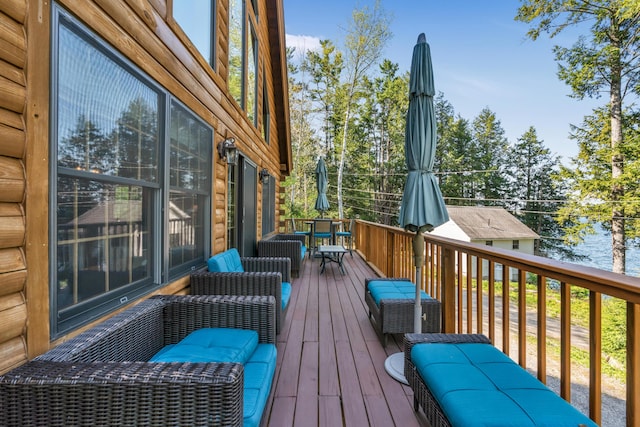 wooden deck with outdoor dining space