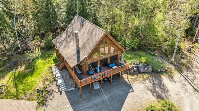 view from above of property featuring a heavily wooded area