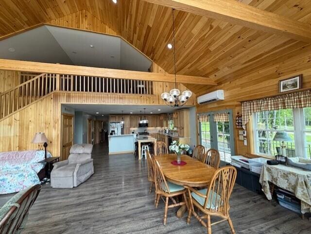 1027 Gardner Creek Rd, Wade, ME 04786 - dining area with a wall mounted air conditioner, wood walls, a chandelier, wood ceiling, and high vaulted ceiling