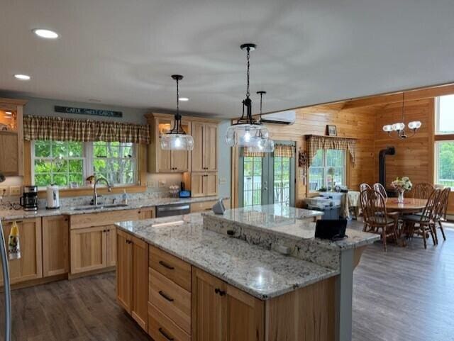 1027 Gardner Creek Rd, Wade, ME 04786 - kitchen with a kitchen island, dark wood-style flooring, light stone counters, hanging light fixtures, and recessed lighting