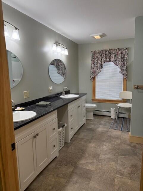 1027 Gardner Creek Rd, Wade, ME 04786 - full bath with double vanity and baseboard heating