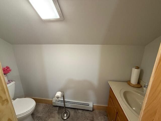 1027 Gardner Creek Rd, Wade, ME 04786 - half bathroom with a baseboard heating unit and vanity