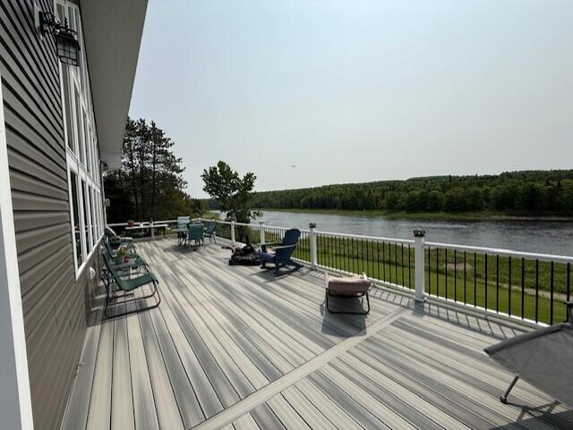 1027 Gardner Creek Rd, Wade, ME 04786 - wooden terrace with a water view and outdoor dining area