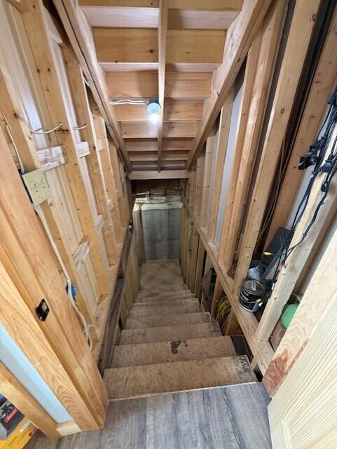 1027 Gardner Creek Rd, Wade, ME 04786 - stairs featuring wood finished floors
