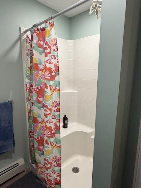 1027 Gardner Creek Rd, Wade, ME 04786 - bathroom featuring a baseboard heating unit and a shower stall