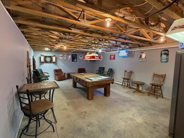 1027 Gardner Creek Rd, Wade, ME 04786 - recreation room with billiards table and unfinished concrete floors