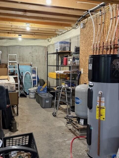1027 Gardner Creek Rd, Wade, ME 04786 - unfinished basement with hybrid water heater and a water pressure tank