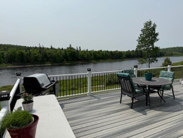 1027 Gardner Creek Rd, Wade, ME 04786 - wooden deck featuring a water view, area for grilling, and a wooded view