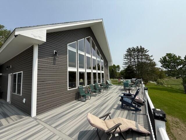 1027 Gardner Creek Rd, Wade, ME 04786 - wooden terrace featuring outdoor dining space and a lawn