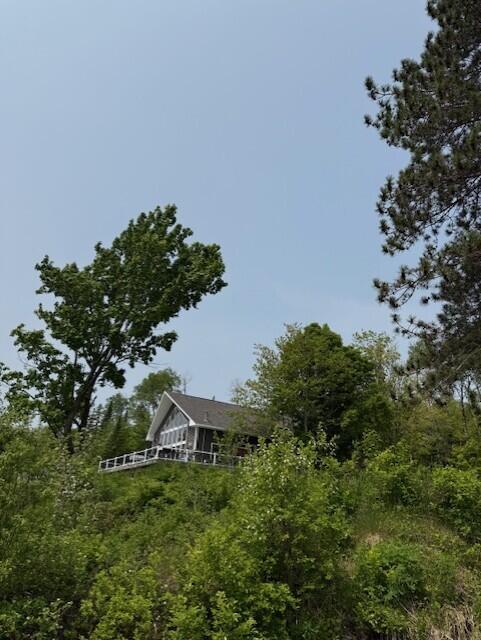 1027 Gardner Creek Rd, Wade, ME 04786 - rear view of house with a view of trees