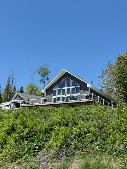 1027 Gardner Creek Rd, Wade, ME 04786 - rear view of house featuring a wooden deck