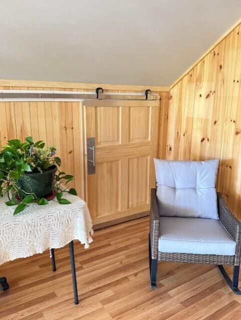 1027 Gardner Creek Rd, Wade, ME 04786 - sitting room with light wood-type flooring and wood walls