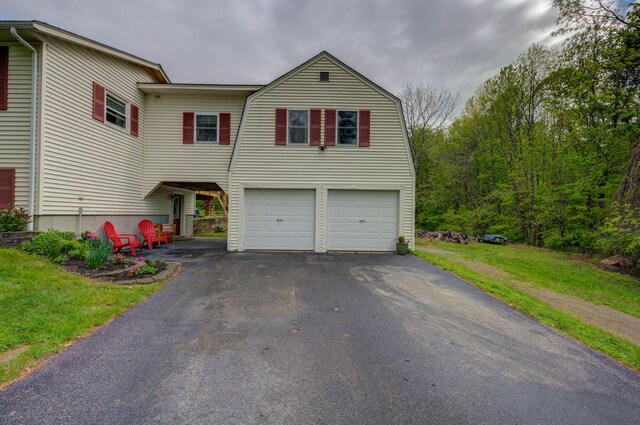 74 Spear Rd, Standish, ME 04084 - view of front facade featuring asphalt driveway and a garage