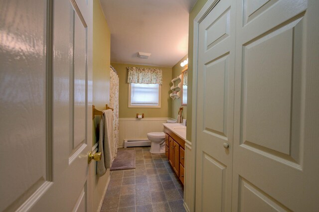 74 Spear Rd, Standish, ME 04084 - bathroom featuring a baseboard radiator, toilet, vanity, wainscoting, and curtained shower