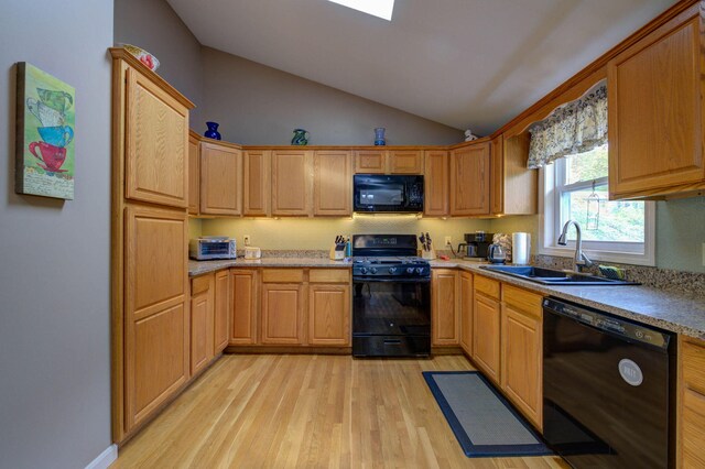 74 Spear Rd, Standish, ME 04084 - kitchen with black appliances, a sink, light wood-style flooring, and vaulted ceiling