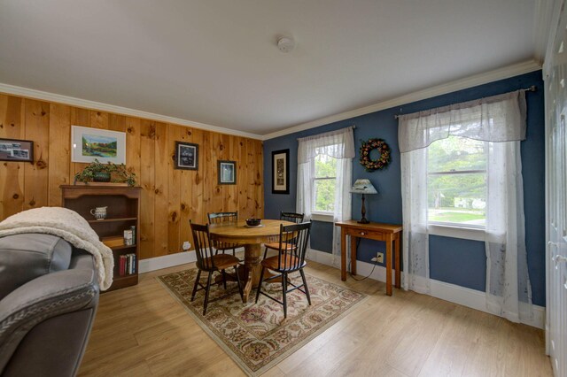 74 Spear Rd, Standish, ME 04084 - dining area featuring ornamental molding, light wood-type flooring, baseboards, and wood walls