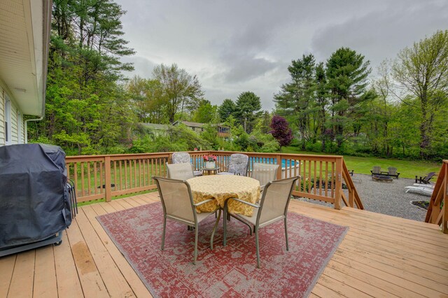 74 Spear Rd, Standish, ME 04084 - wooden terrace featuring outdoor dining area, a fire pit, and area for grilling
