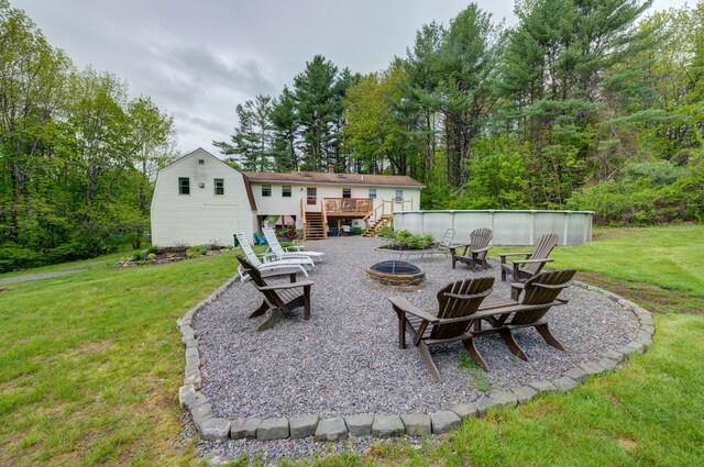 74 Spear Rd, Standish, ME 04084 - view of patio / terrace featuring a fire pit, stairs, and a deck