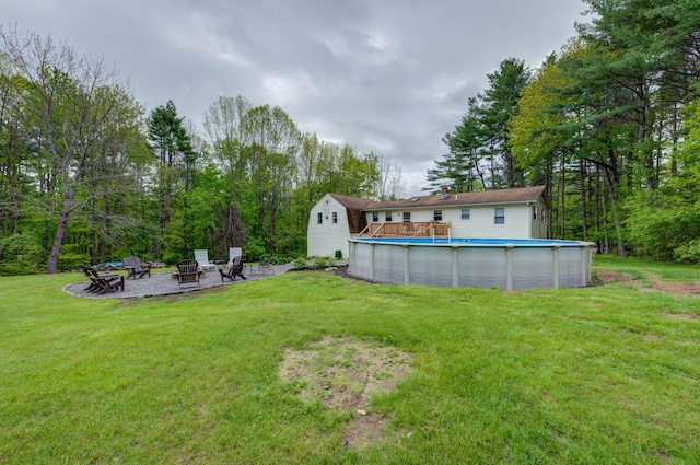 74 Spear Rd, Standish, ME 04084 - view of green lawn with a fire pit and an outdoor pool