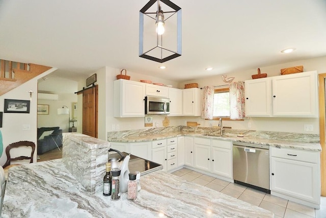 387 Nicolin Rd, Ellsworth, ME 04605 - kitchen featuring stainless steel appliances, a sink, white cabinetry, light tile patterned floors, and recessed lighting