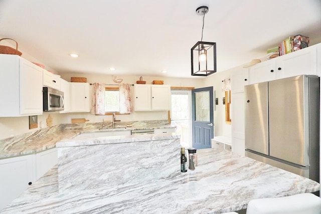 387 Nicolin Rd, Ellsworth, ME 04605 - kitchen with stainless steel appliances, a sink, white cabinetry, plenty of natural light, and recessed lighting