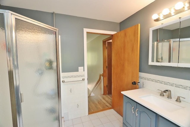 387 Nicolin Rd, Ellsworth, ME 04605 - bathroom with a stall shower, tile patterned floors, vanity, and tile walls