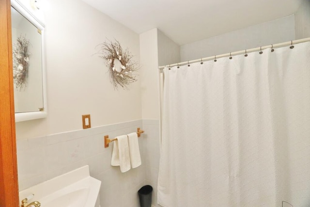 387 Nicolin Rd, Ellsworth, ME 04605 - full bath with tile walls, a wainscoted wall, and curtained shower