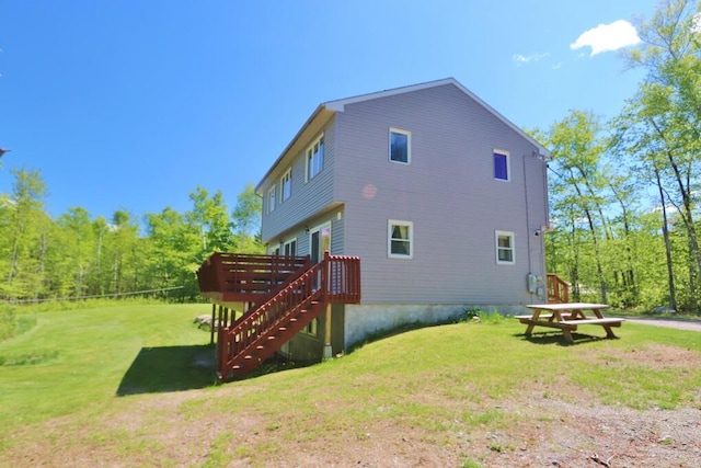 387 Nicolin Rd, Ellsworth, ME 04605 - back of property with a deck and a lawn