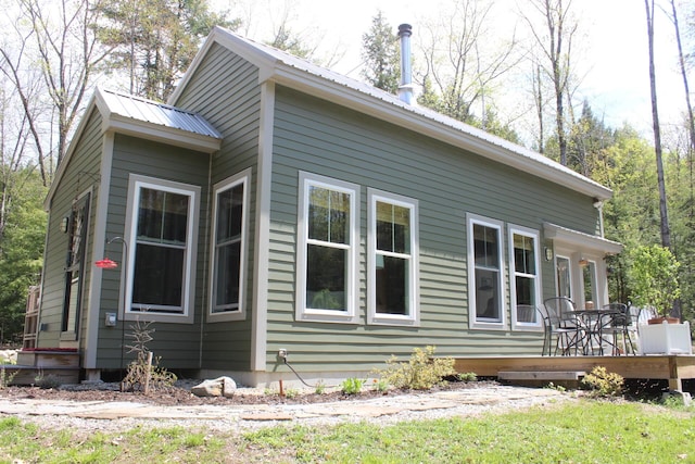 382 Riverbend Rd, Brownfield, ME 04010 - view of home's exterior featuring metal roof and a wooden deck