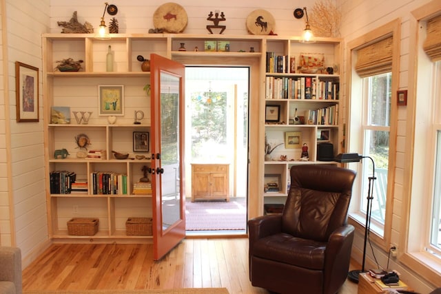 382 Riverbend Rd, Brownfield, ME 04010 - sitting room with wood finished floors, wooden walls, and a desk
