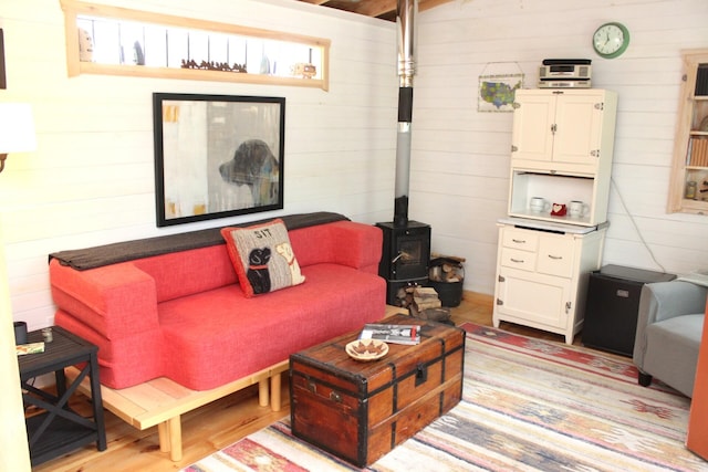 382 Riverbend Rd, Brownfield, ME 04010 - living room featuring a wood stove and wood walls