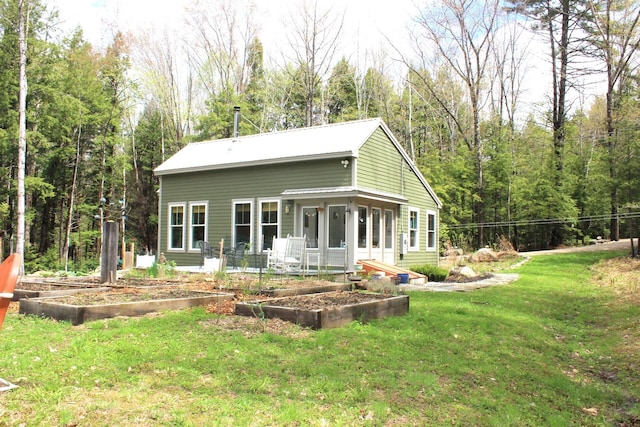 382 Riverbend Rd, Brownfield, ME 04010 - rear view of property featuring a garden and a lawn