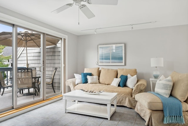living area with rail lighting, tile patterned floors, and a ceiling fan