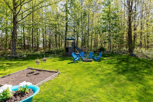 188 Boothbay Rd, Edgecomb, ME 04556 - view of green lawn with a playground and a fire pit