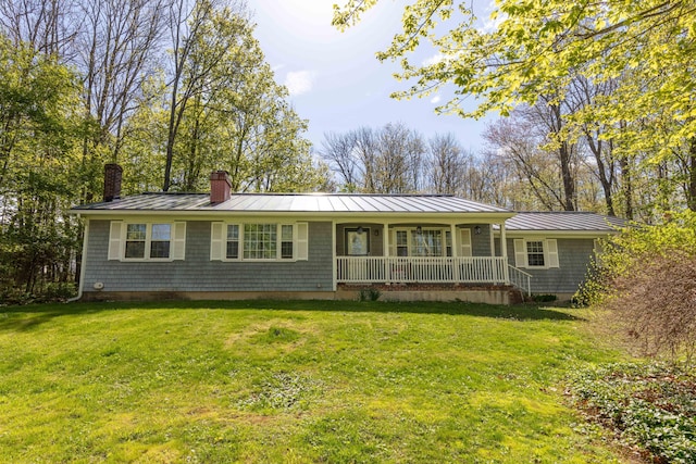 188 Boothbay Rd, Edgecomb, ME 04556 - ranch-style house featuring covered porch, a chimney, a standing seam roof, a front yard, and a metal roof