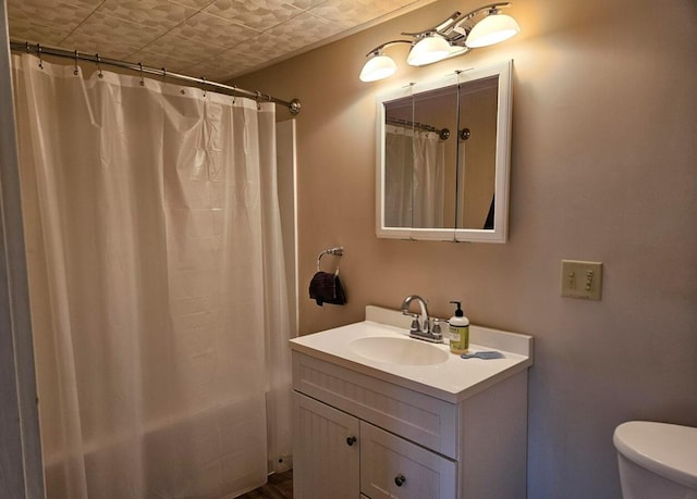 20 Sylvan Ave, Lewiston, ME 04240 - bathroom featuring vanity, toilet, an ornate ceiling, and shower / bath combo