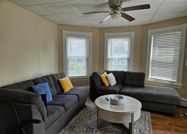 20 Sylvan Ave, Lewiston, ME 04240 - living area with a paneled ceiling, wood finished floors, a ceiling fan, and a baseboard heating unit