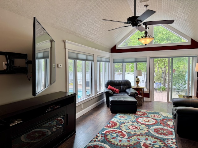 10 Goulet St, Lewiston, ME 04240 - living room with lofted ceiling, healthy amount of natural light, a ceiling fan, and dark wood-style floors