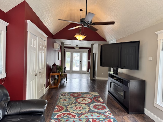 10 Goulet St, Lewiston, ME 04240 - living area featuring a wall mounted AC, ceiling fan, dark wood-style flooring, vaulted ceiling, and decorative columns